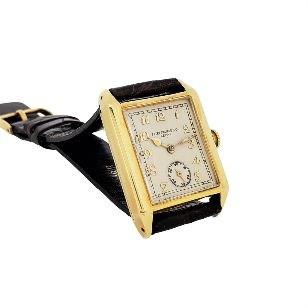 Patek Philippe early Art Deco rectangular tank style watch, 18K with Breguet numerals Circa 1928, Retailed by Beyer