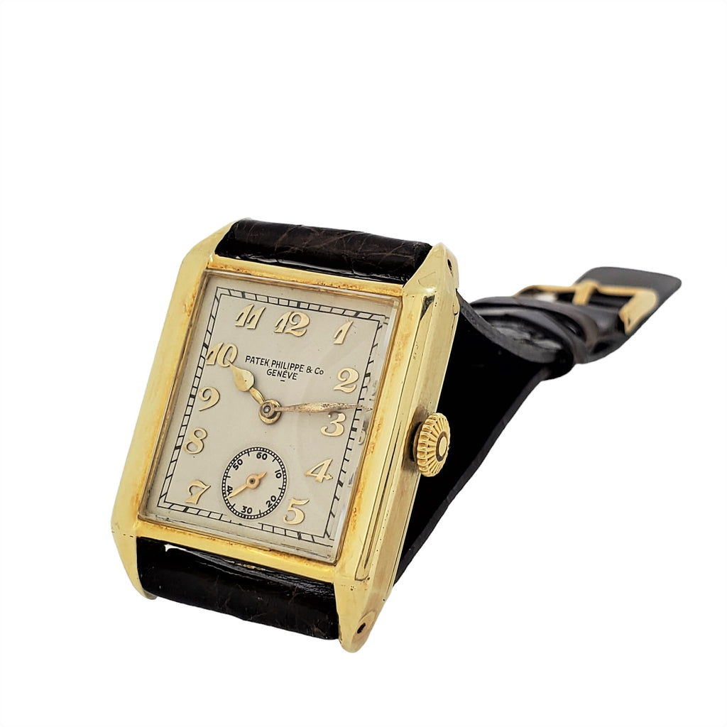 Patek Philippe early Art Deco rectangular tank style watch, 18K with Breguet numerals Circa 1928, Retailed by Beyer