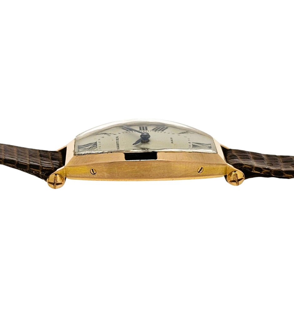 Cartier Paris Rose Gold Tonneau shaped watch that curves on the wrist.  Circa 1990's